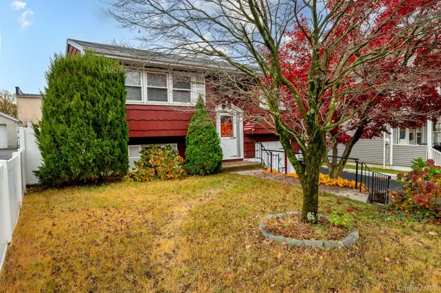 a front view of a house with a yard