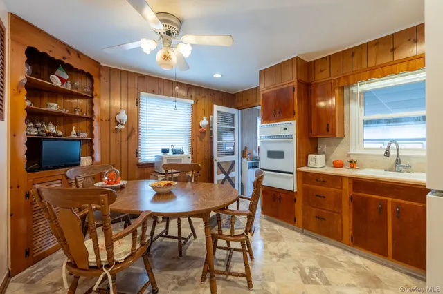 a view of a dining room with furniture and window
