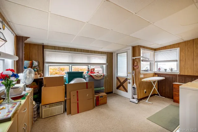 a bed room with furniture and a window