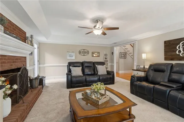 a bedroom with a bed a flat screen tv and a couch