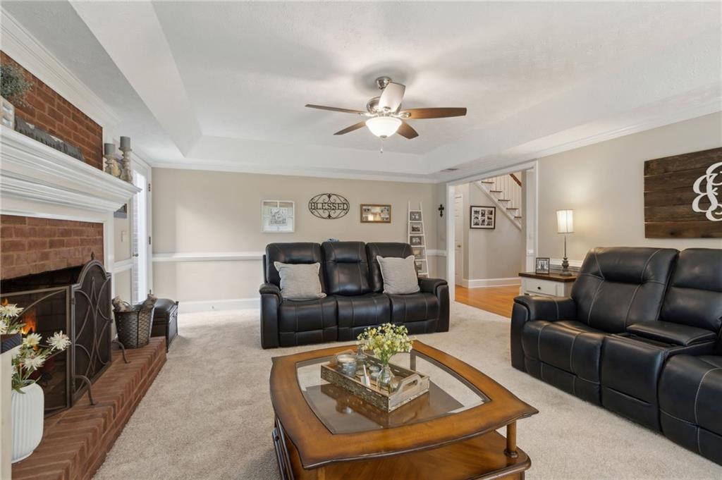 83 Russell Road Lawrenceville, GA 30043 - Photo 19 of 67 a living room with furniture and a fireplace