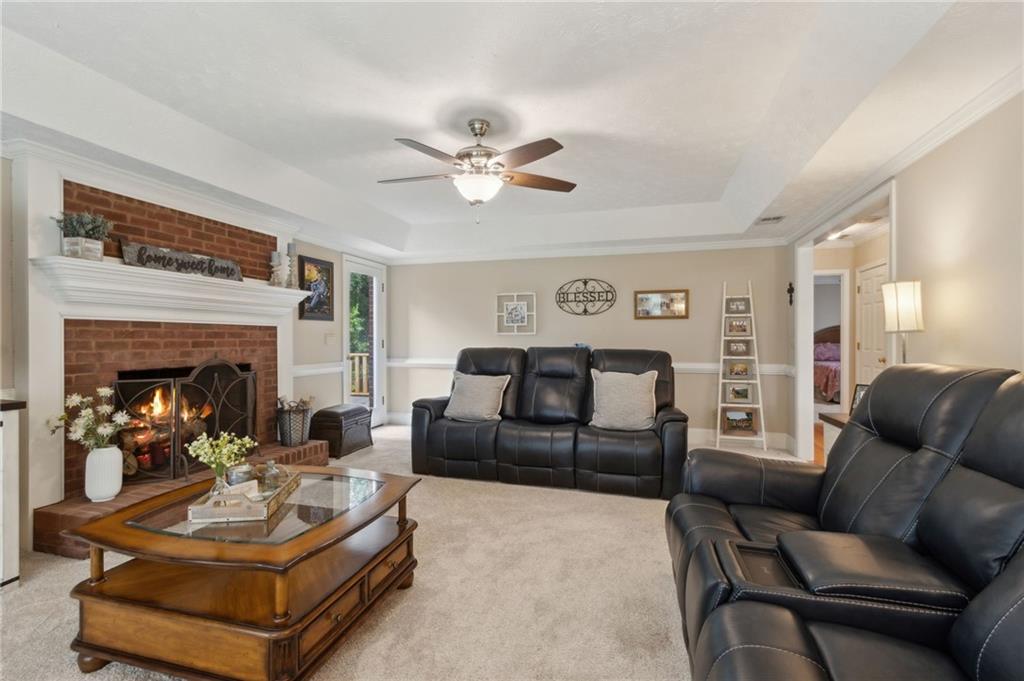 83 Russell Road Lawrenceville, GA 30043 - Photo 20 of 67 a living room with furniture and a fireplace