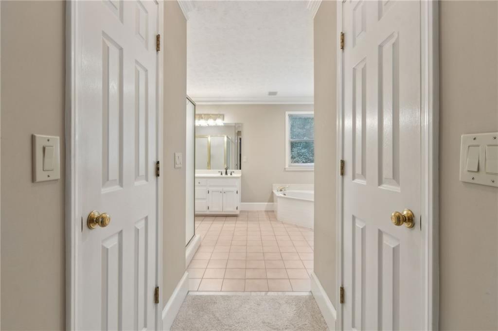 83 Russell Road Lawrenceville, GA 30043 - Photo 27 of 67 a bathroom with a glass door shower
