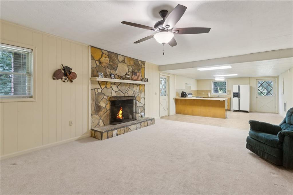 83 Russell Road Lawrenceville, GA 30043 - Photo 45 of 67 a living room with furniture and a fireplace