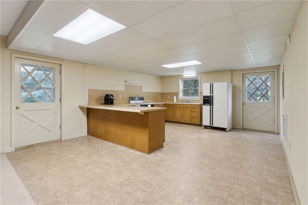 83 Russell Road Lawrenceville, GA 30043 - Photo 46 of 67 a view of a kitchen with a sink cabinets and window