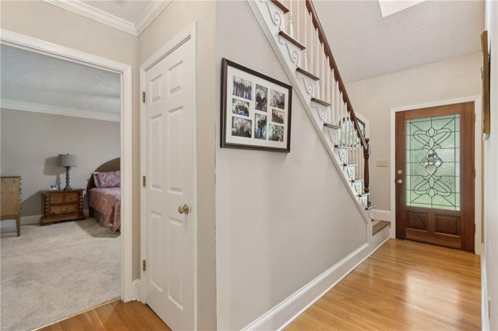 83 Russell Road Lawrenceville, GA 30043 - Photo 5 of 67 a view of a hallway to rooms and stairs