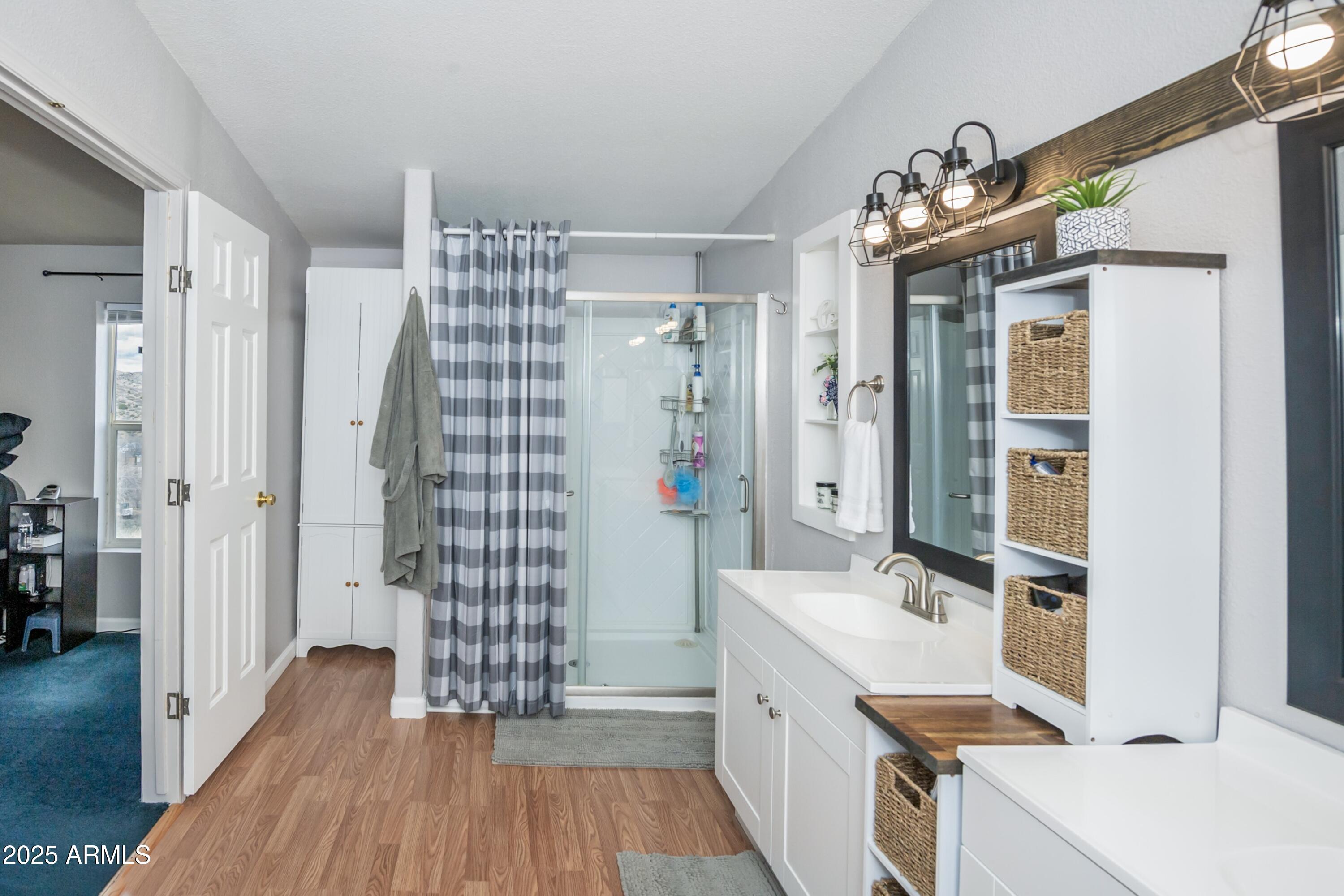 12320 Jacobs Road Mayer, AZ 86333 - Photo 17 of 37 a bathroom with a sink a toilet and shower