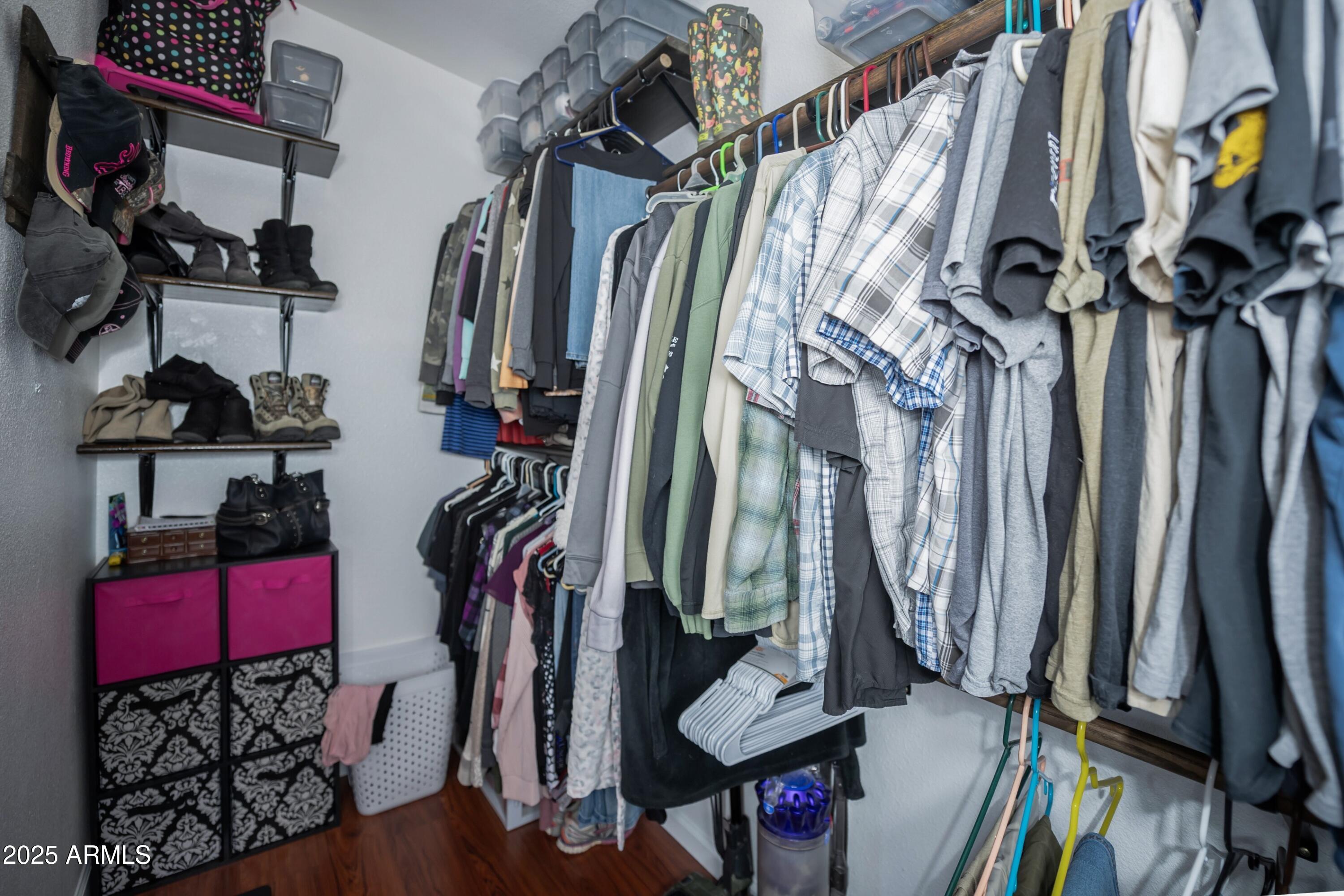 12320 Jacobs Road Mayer, AZ 86333 - Photo 18 of 37 a view of walk in closet with clothes and shoes