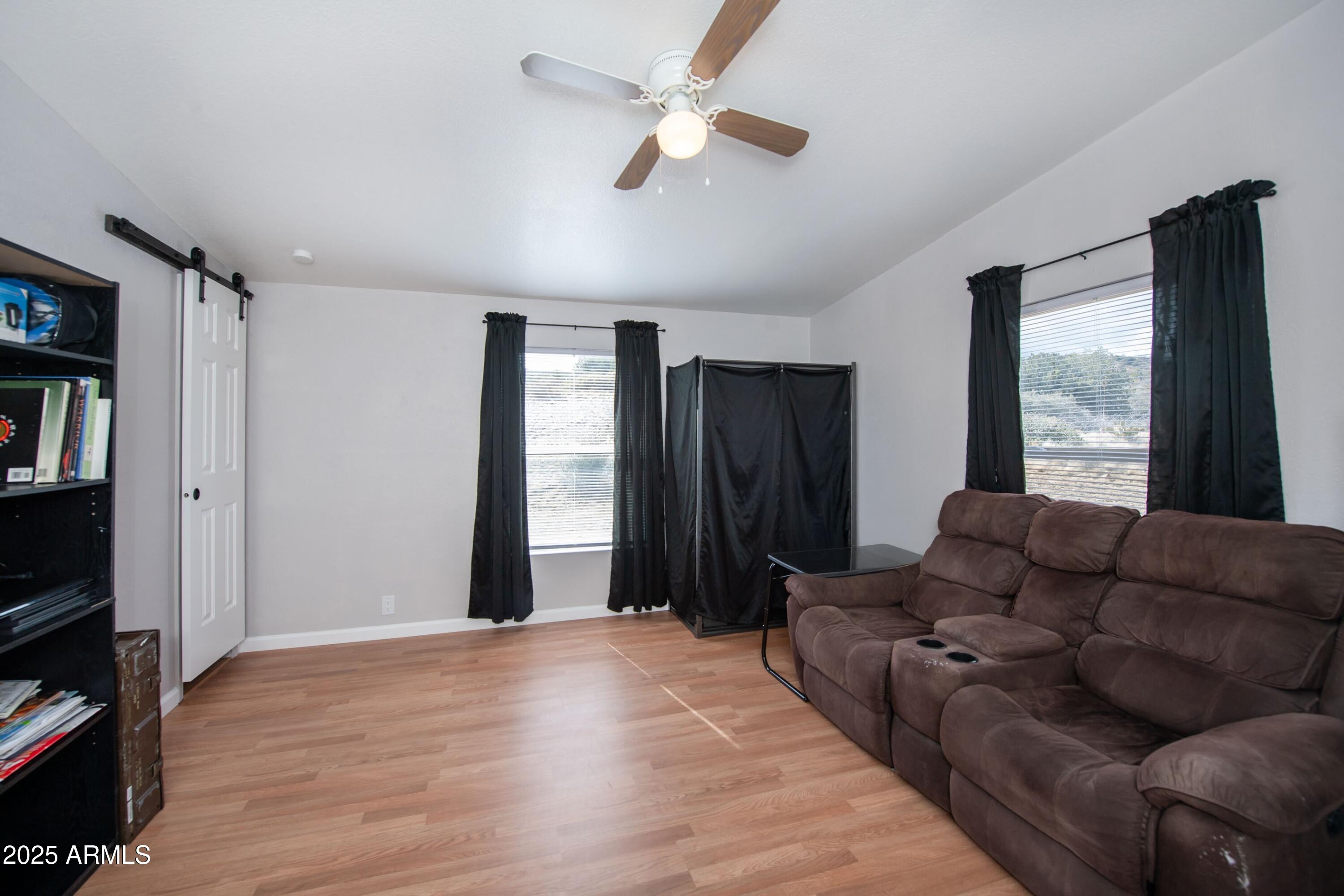 12320 Jacobs Road Mayer, AZ 86333 - Photo 19 of 37 a living room with furniture and a flat screen tv