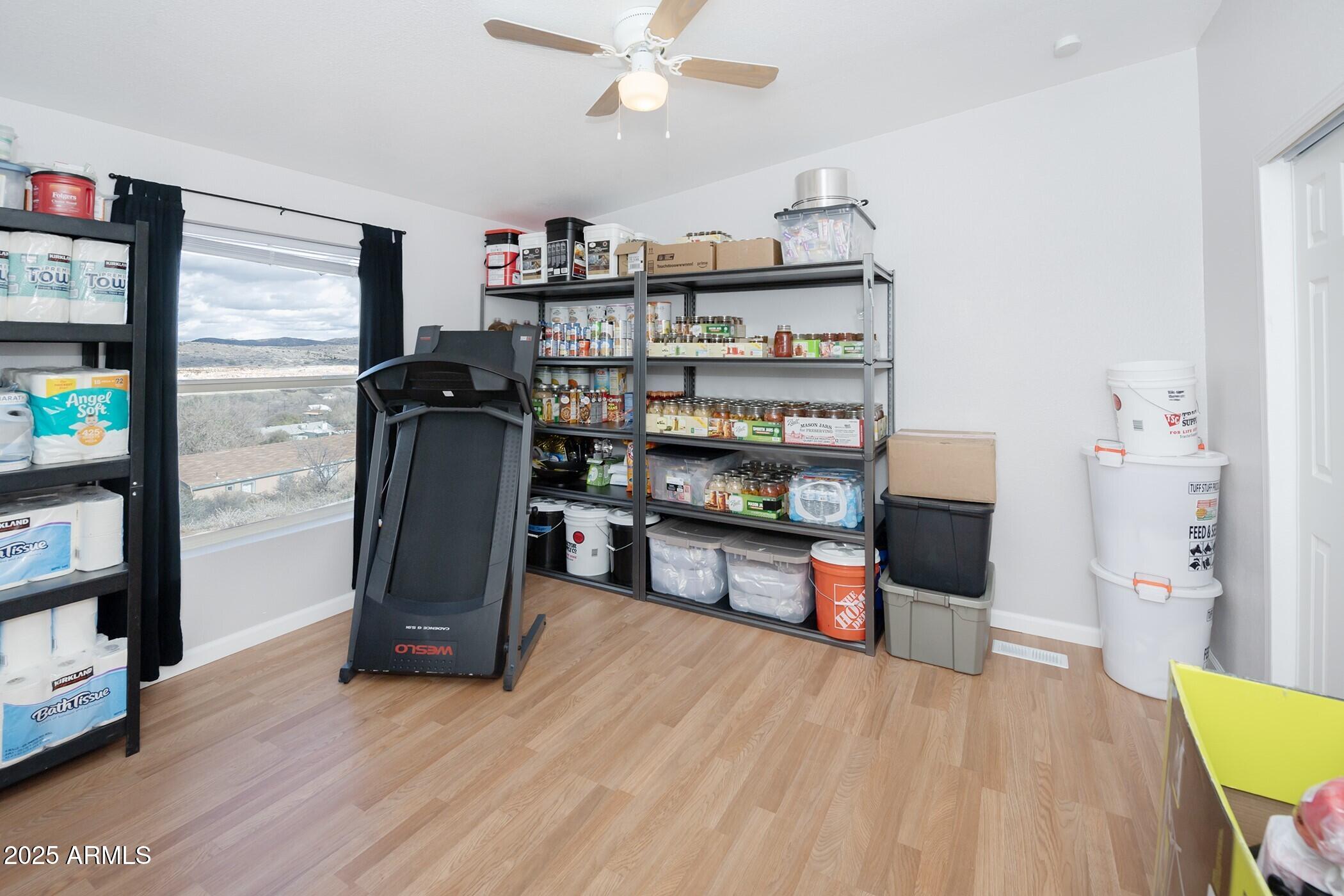 12320 Jacobs Road Mayer, AZ 86333 - Photo 25 of 37 a living room with stainless steel appliances furniture a flat screen tv and a refrigerator