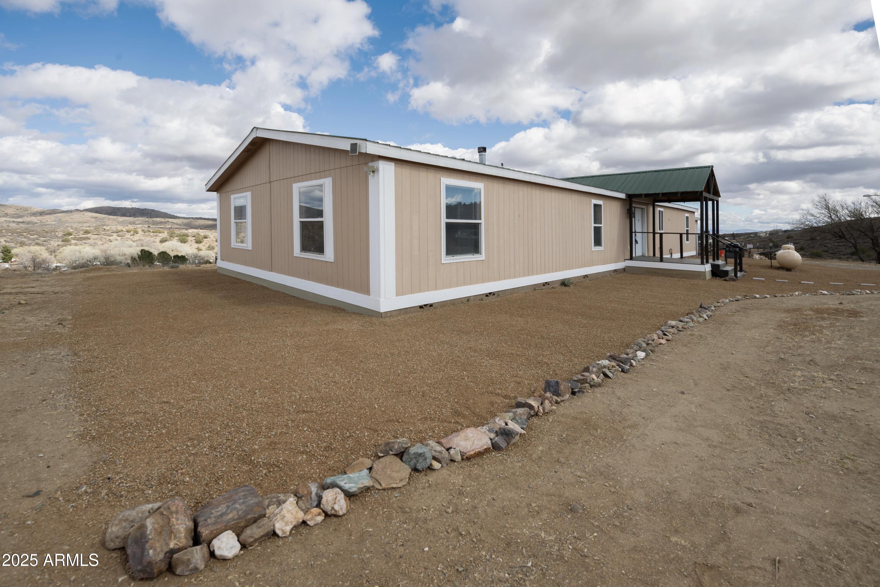 12320 Jacobs Road Mayer, AZ 86333 - Photo 30 of 37 a view of a house with a yard