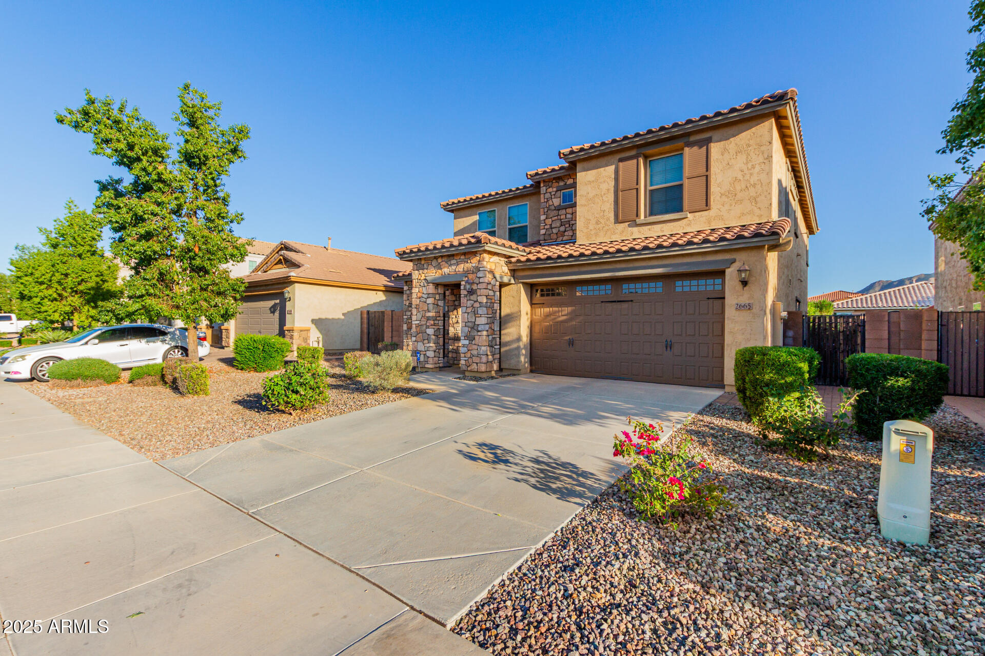 2665 East Gillcrest Road Gilbert, AZ 85298 - Photo 6 of 48 a front view of a house with a yard