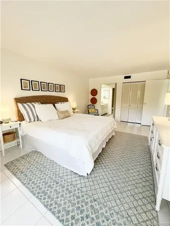 a bedroom with a bed and a walk in closet