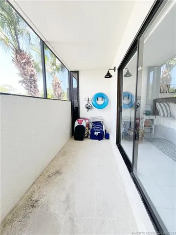 a living room with a table and chairs