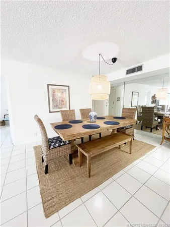 a living room with a table and chairs