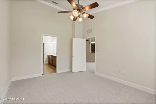 a bathroom with a double vanity sink a mirror and a shower