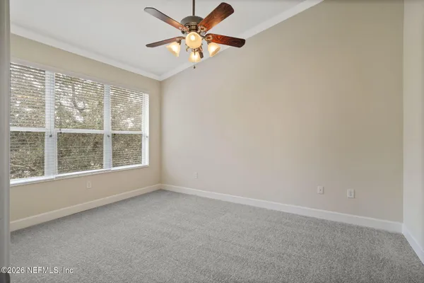 a view of an empty room and window