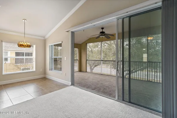 a view of an empty room with a large window