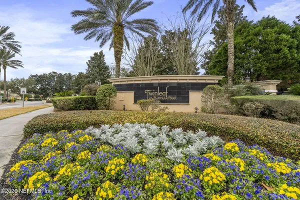 a view of a lake with houses in the background