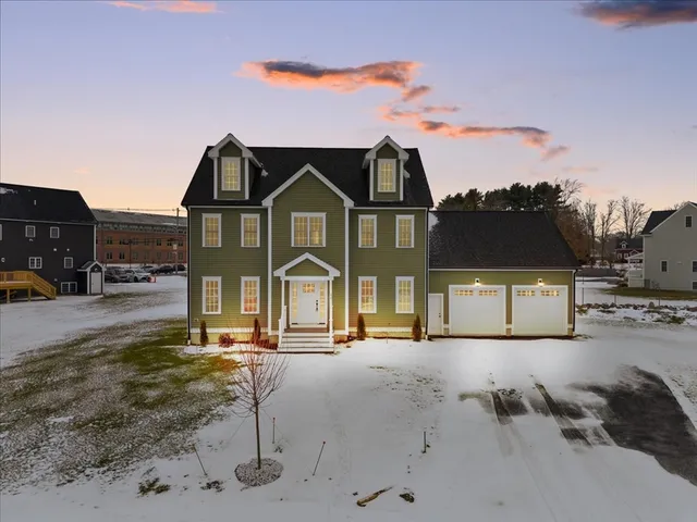a front view of a house with a yard