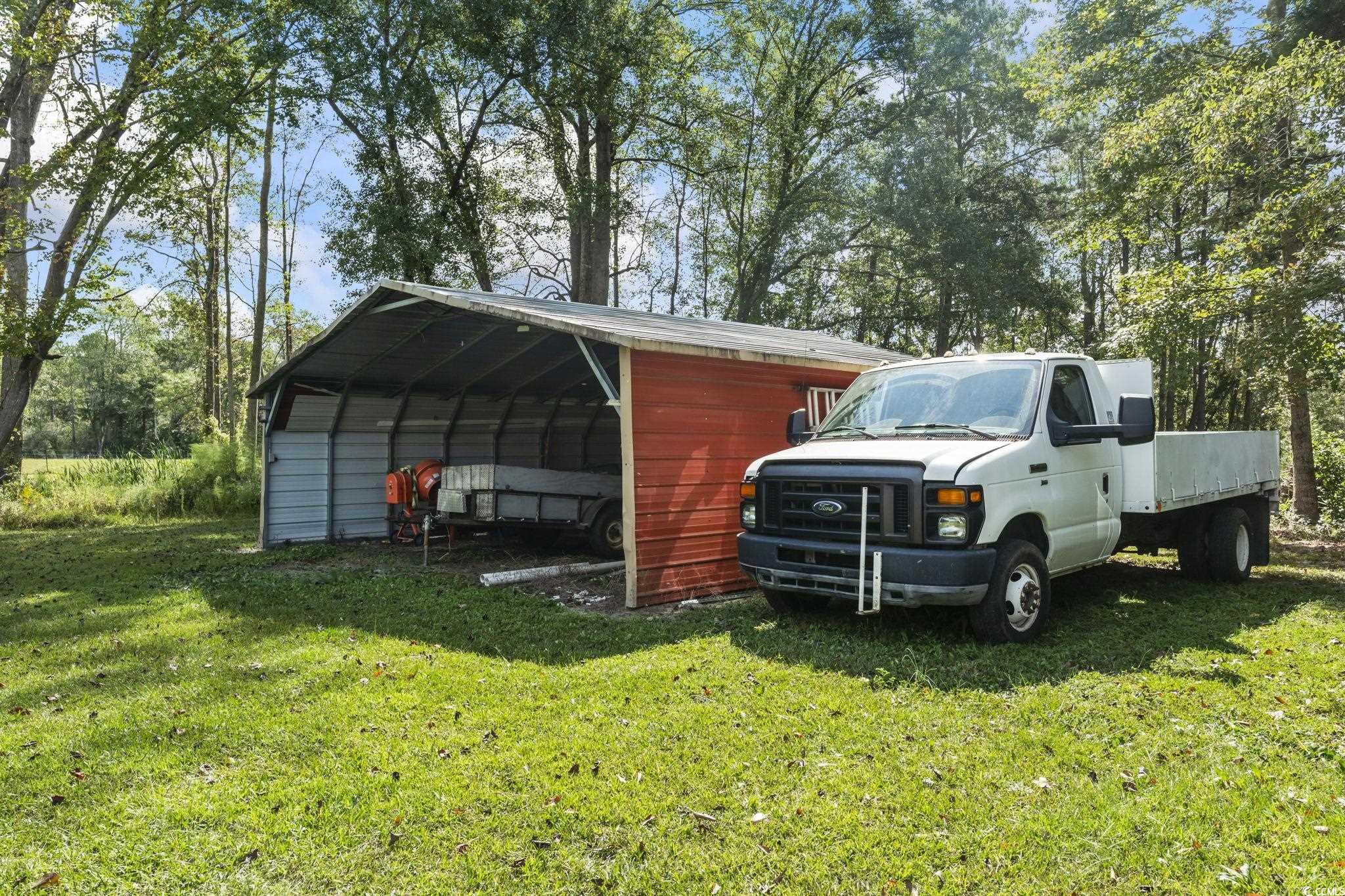1585 Daisy Road Loris, SC 29569 - Photo 38 of 48 View of outdoor structure featuring a carport