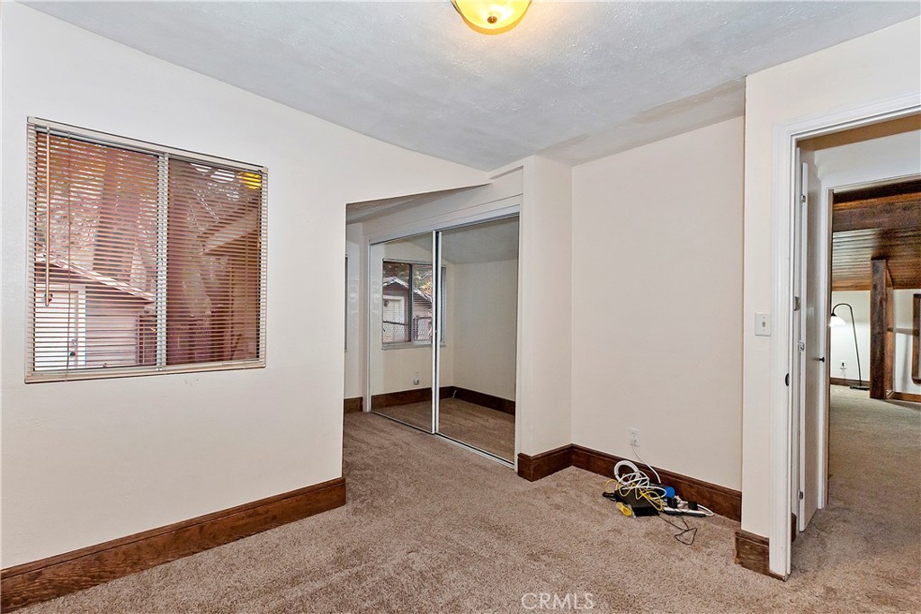810 Community Drive Lake Arrowhead, CA 92352 - Photo 20 of 30 an empty room with windows