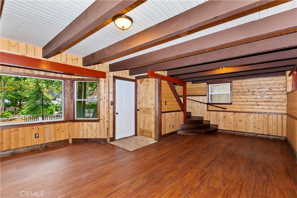 810 Community Drive Lake Arrowhead, CA 92352 - Photo 9 of 30 a view of an empty room with a window and wooden floor