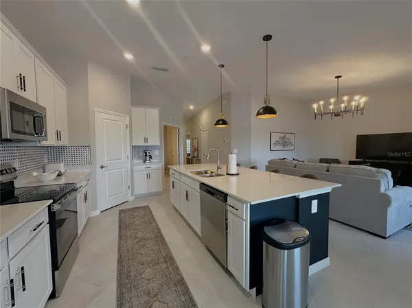 a kitchen with a stove and a sink