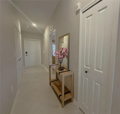 a dining room with furniture and chandelier