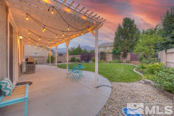 10520 Baton Court Reno, NV 89521 - Photo 36 of 38 a view of a house with backyard porch and sitting area