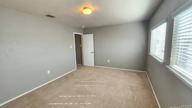 an empty room with windows