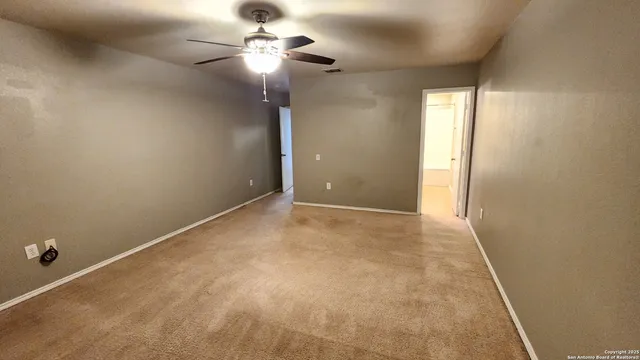 a bathroom with a tub sink shower and a mirror