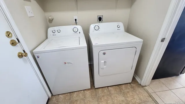 a utility room with dryer and washer