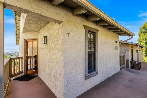 a living room with fireplace furniture and a flat screen tv