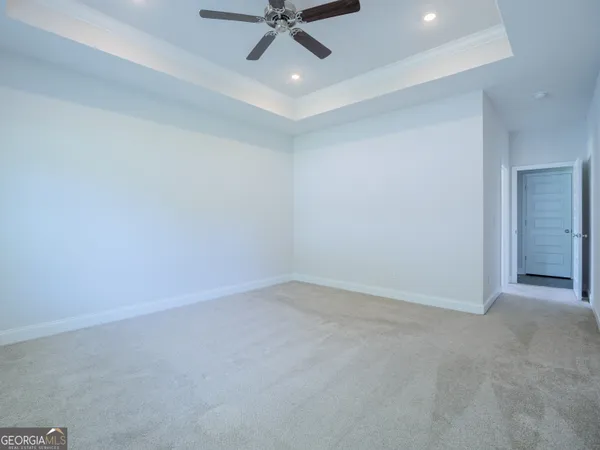 an empty room with a empty space and windows