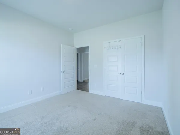 a view of an empty room and a window