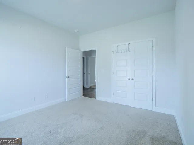 a view of an empty room and a window