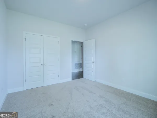 a bathroom with a granite countertop sink a toilet and a bathtub