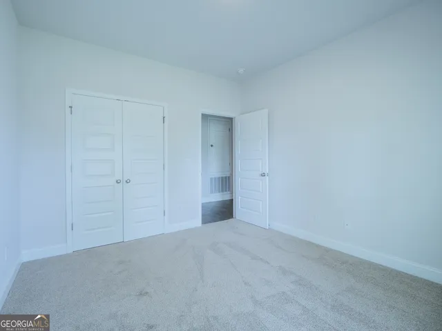 a bathroom with a granite countertop sink a toilet and a bathtub