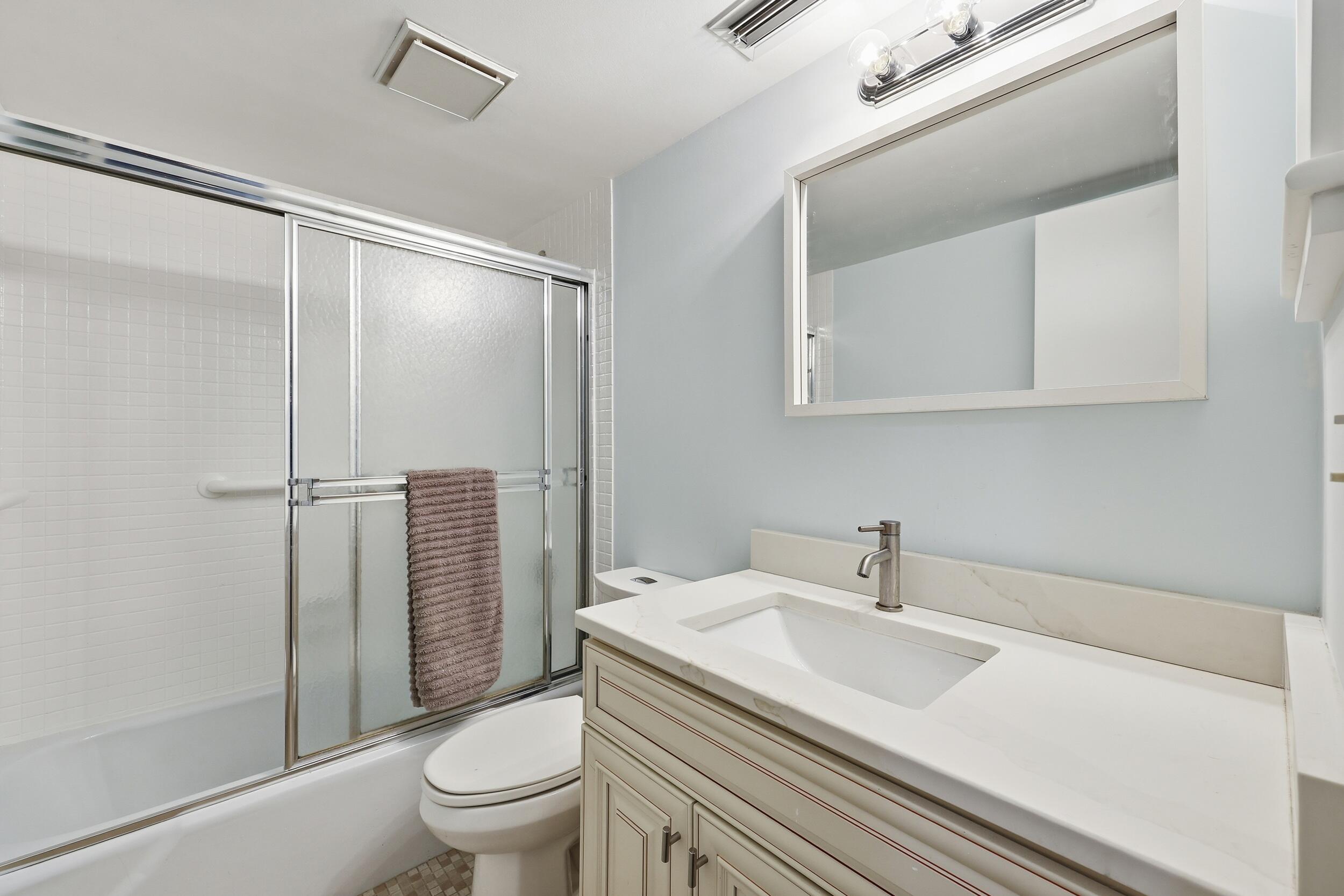 5111 Southeast Miles Grant Road, Unit 102 Stuart, FL 34997 - Photo 21 of 30 Guest Bath