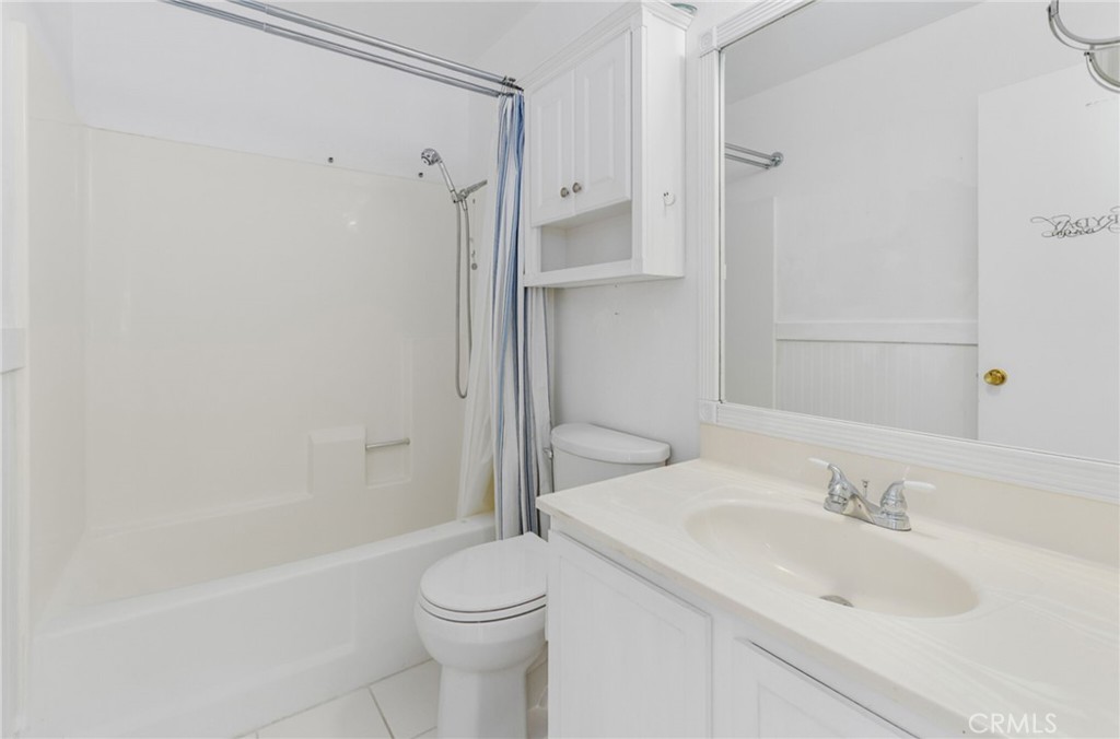 29368 Murrieta Road Menifee, CA 92586 - Photo 15 of 20 a bathroom with a sink toilet and shower