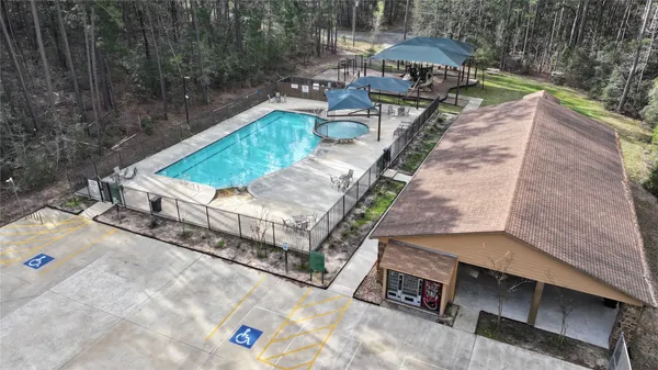 an aerial view of a house with outdoor space