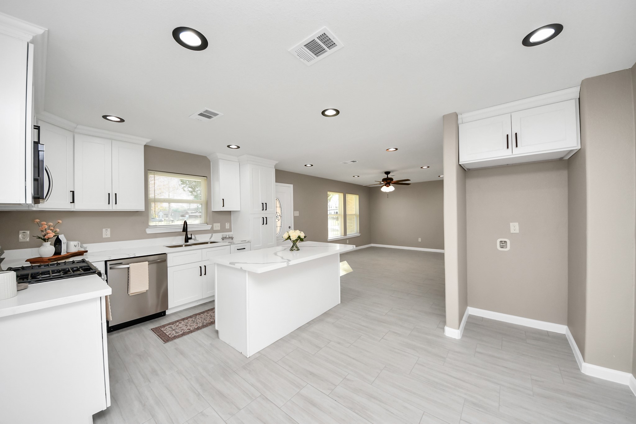 8918 Vinearbor Street Houston, TX 77033 - Photo 14 of 35 a kitchen with a sink stove and cabinets
