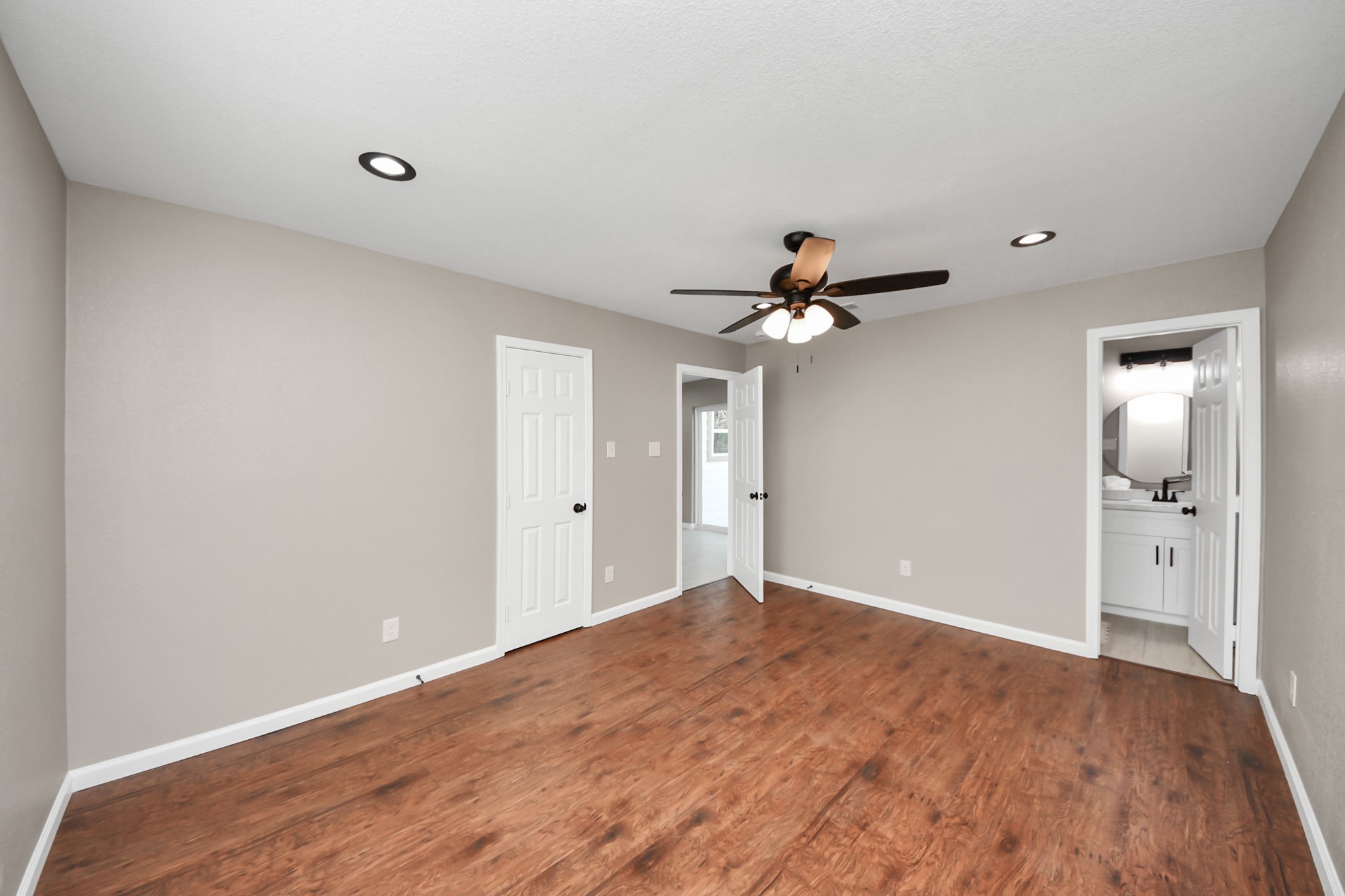 8918 Vinearbor Street Houston, TX 77033 - Photo 23 of 35 a view of empty room with wooden floor
