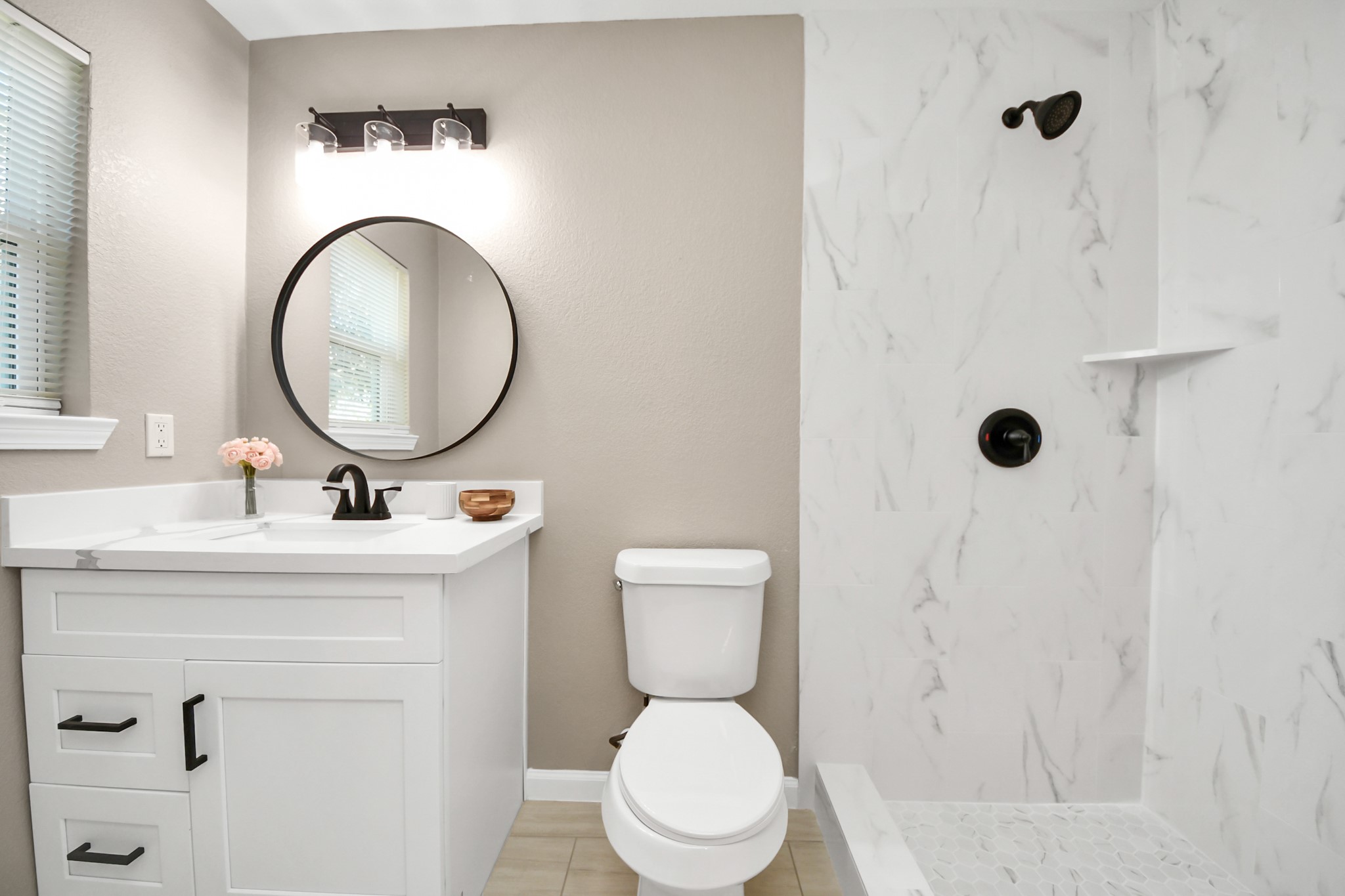 8918 Vinearbor Street Houston, TX 77033 - Photo 28 of 35 a bathroom with a toilet a sink and a mirror