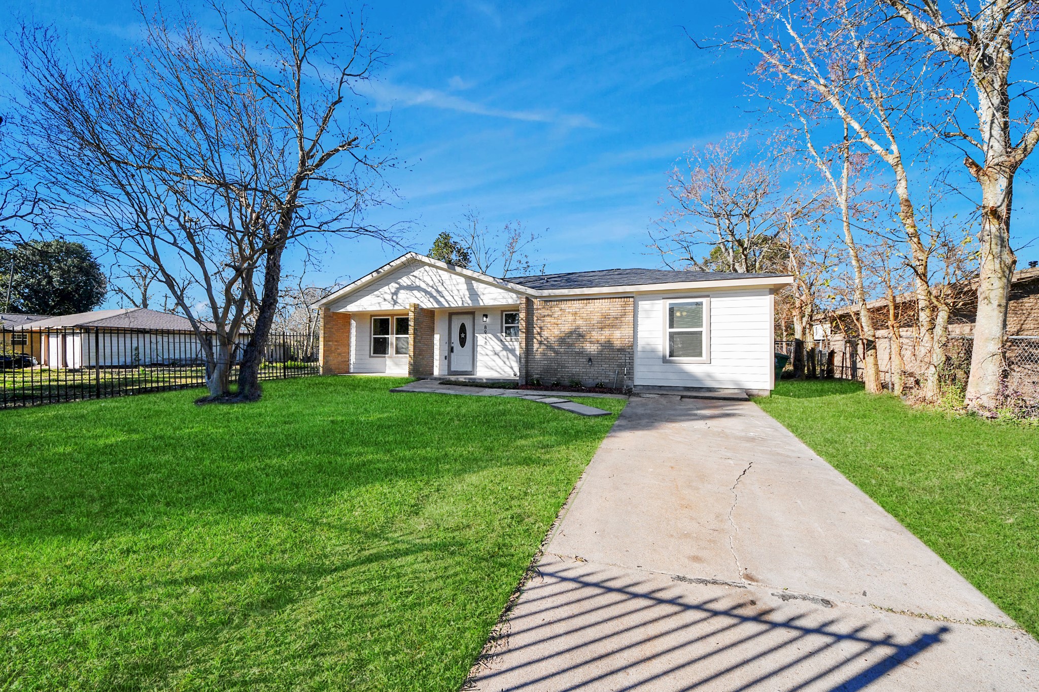 8918 Vinearbor Street Houston, TX 77033 - Photo 3 of 35 a view of house with a yard