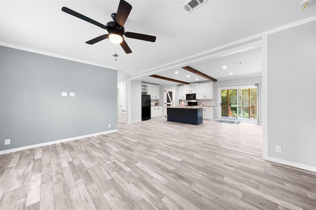 211 3900th Road Gilmer, TX 75644 - Photo 11 of 30 a view of empty room with wooden floor and ceiling fan