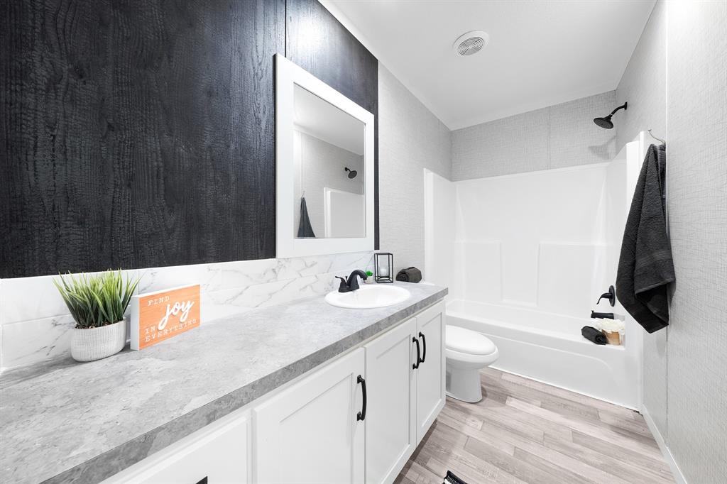 211 3900th Road Gilmer, TX 75644 - Photo 20 of 30 a bathroom with a double vanity sink and mirror