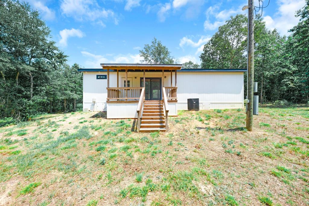 211 3900th Road Gilmer, TX 75644 - Photo 27 of 30 front view of a house with a yard