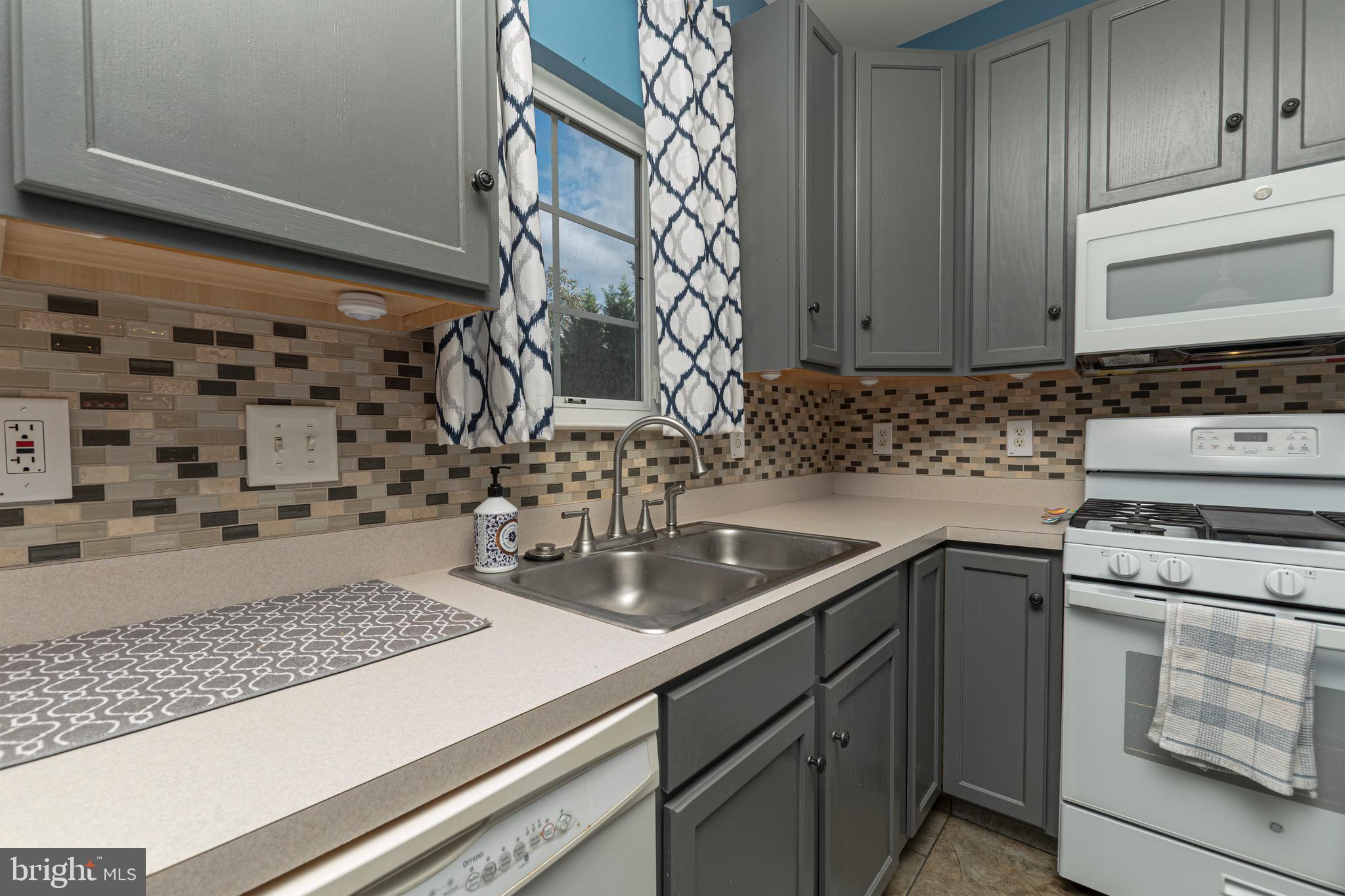 27 Basalt Street Townsend, DE 19734 - Photo 15 of 45 a kitchen with a sink and cabinets